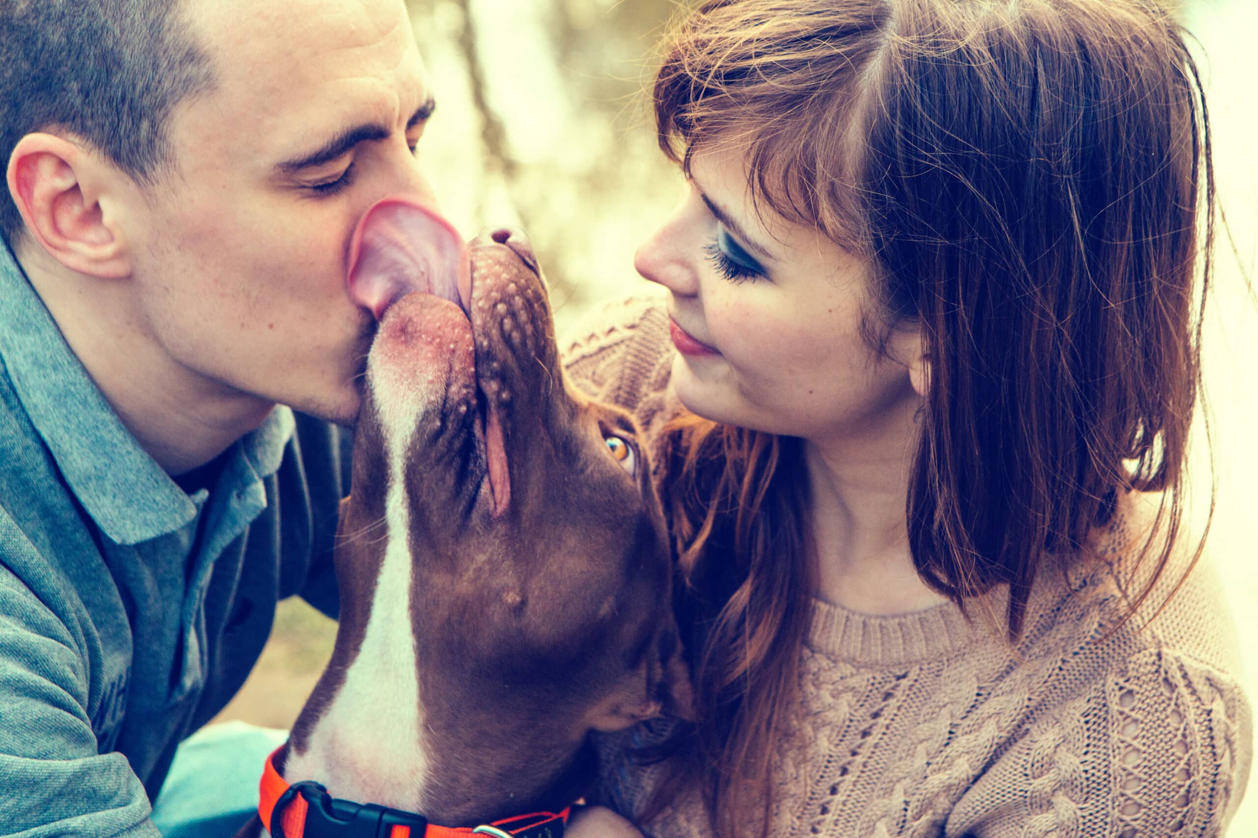 happy couple with dog who has a doggie door